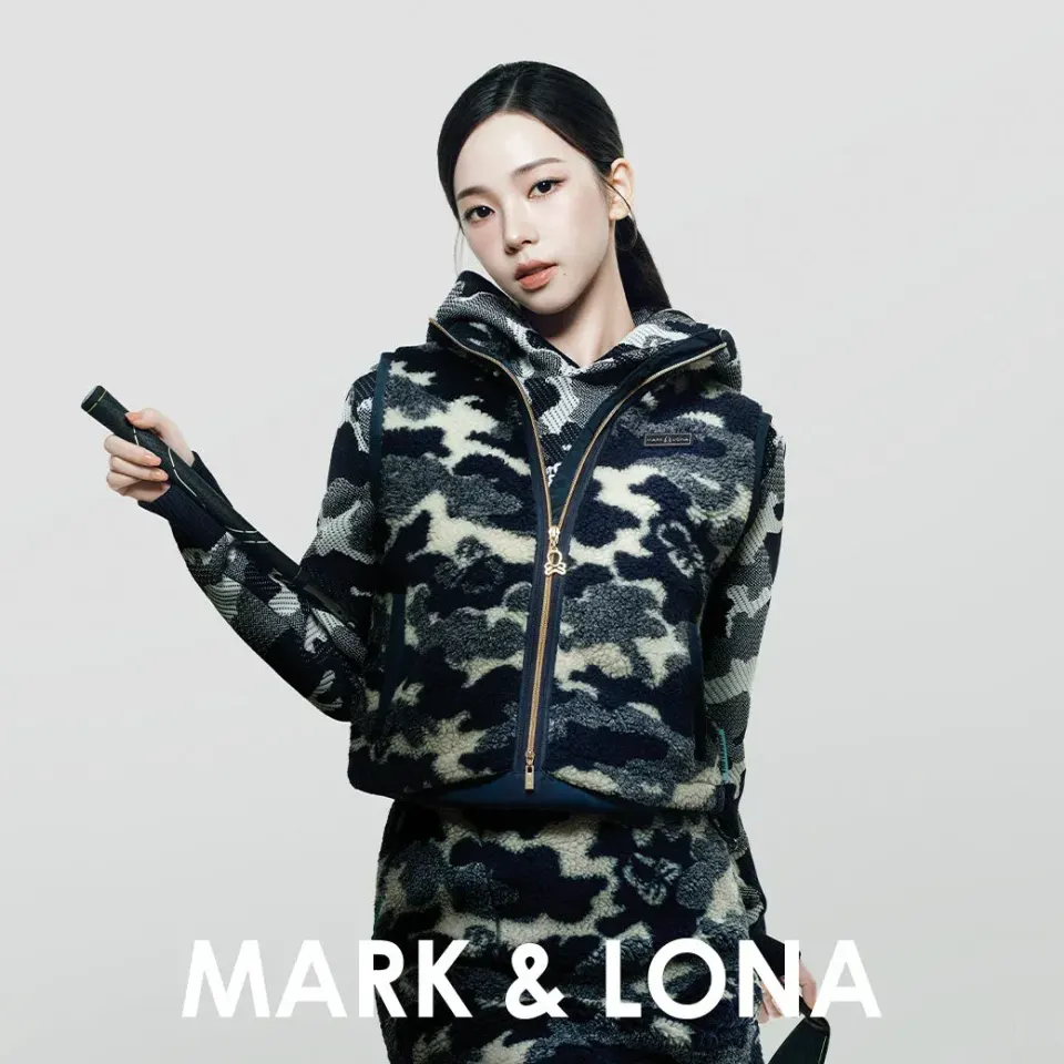 KARINA in a navy camo boa fleece vest and hoodie
